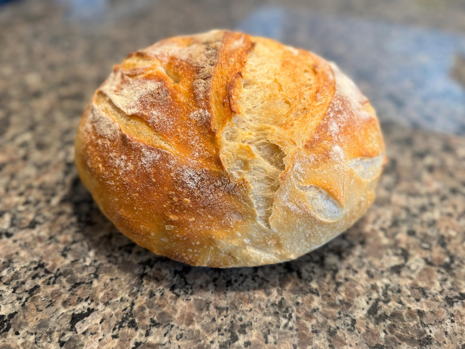 Freshly Baked Sourdough Bread A golden loaf of freshly baked sourdough bread.